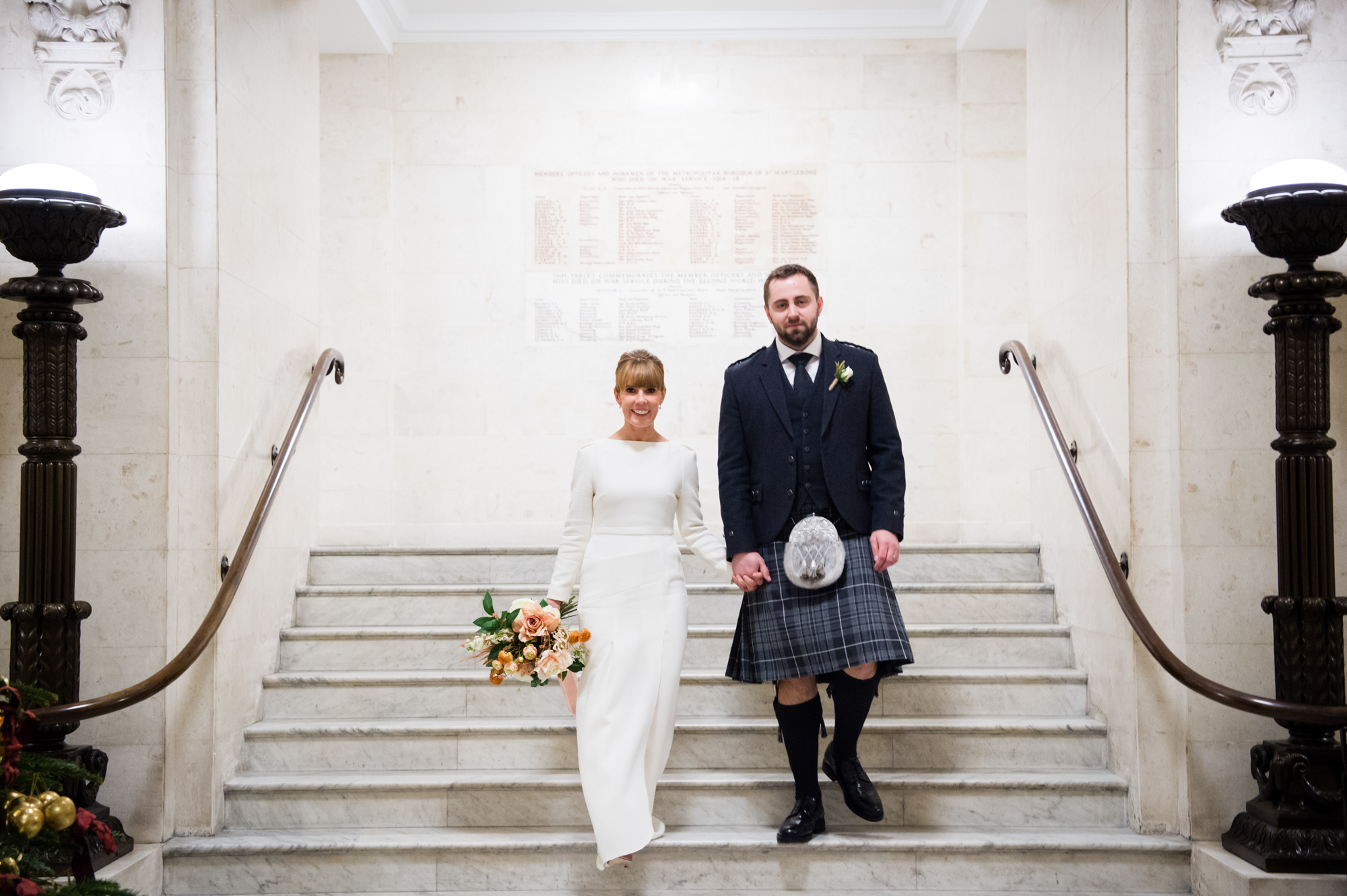 A couple having their wedding photography done at Marylebone Town Hall in London